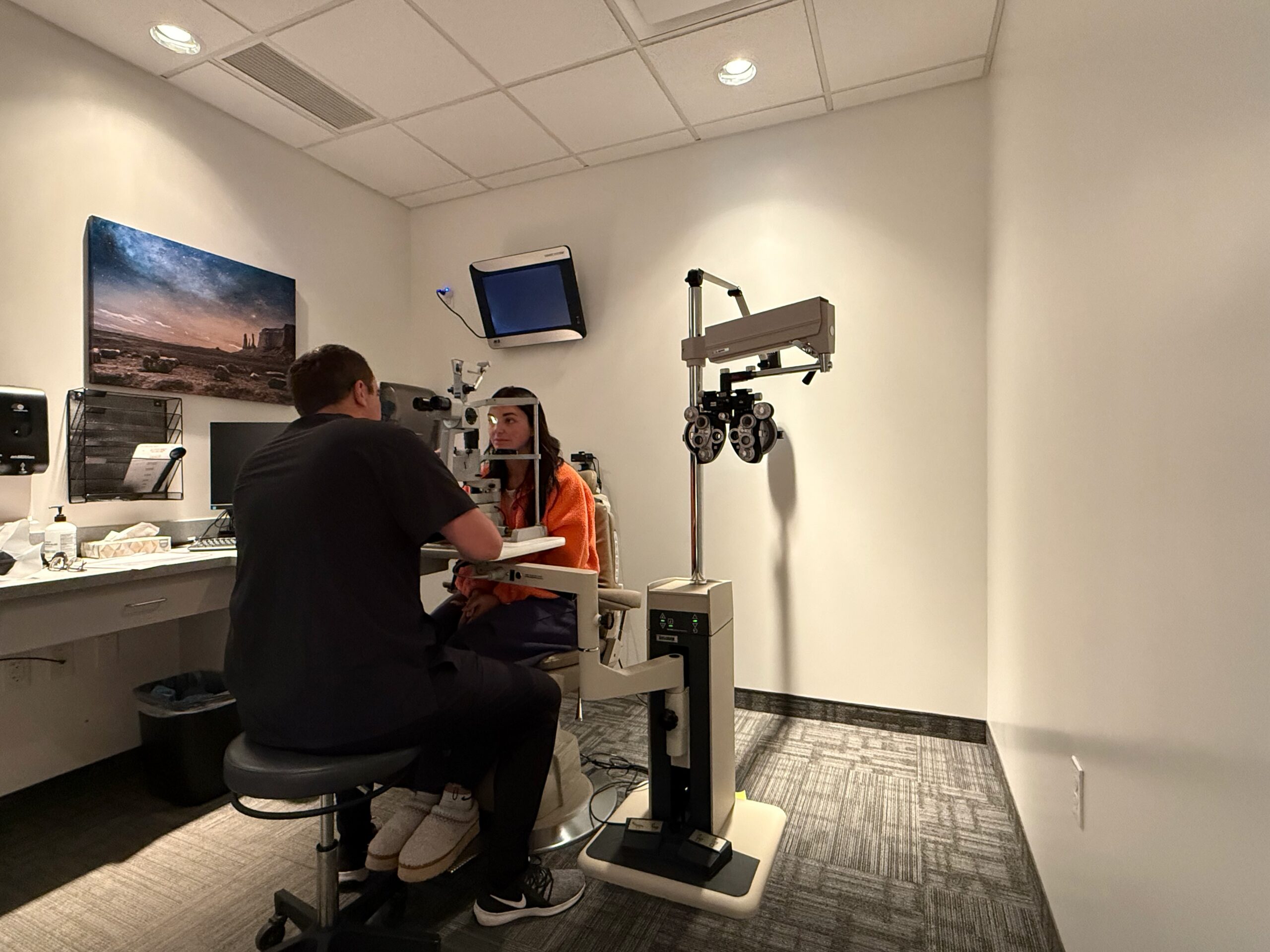 A patient having a follow-up eye evaluation at Hoopes Vision